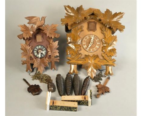 A Swiss made mid Century cuckoo clock together with a smaller example. (2) 
