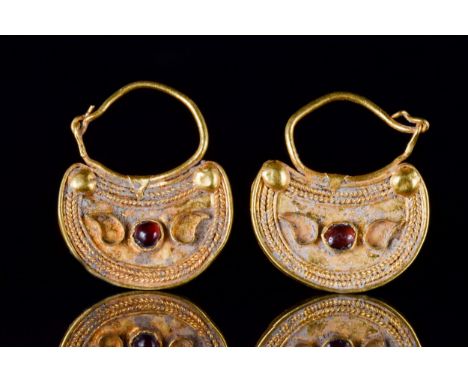 Ca. 300-100 BCA pair of beautiful gold earrings, each comprising a wire hoop with hooked attachment and a crescentic plaque w