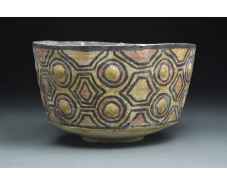 Ca. 2700-2000 BCA wheel-thrown pottery cup with a circular foot, a broad base, tall walls, and a slightly flared rim surround