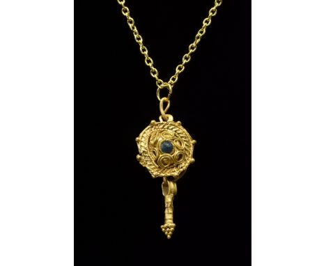 Ca. 100-300 ADA gold discoid pendant with a twisted wire edge, decorated at even intervals with fine granules. The central se