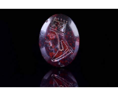 Ca. 100 BCAn oval blood stone intaglio with sloping edge rising from the surface of the bezel. The obverse featuring an image