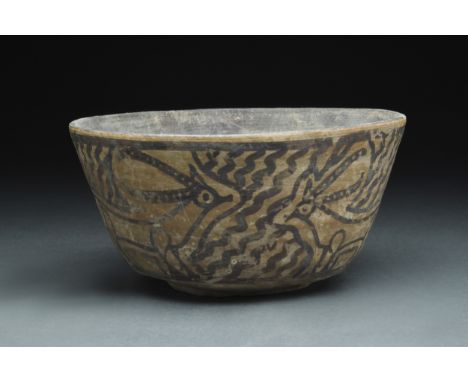 Ca. 2700-2000 BCA pottery cup with a petite circular foot, a broad base, tall walls, and a slightly flared rim surrounding th