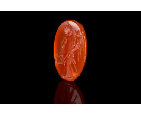 Ca. 100-300 ADAn Ancient Roman carnelian intaglio stone in a flat oval shape. The stone is finely carved with the image of Go
