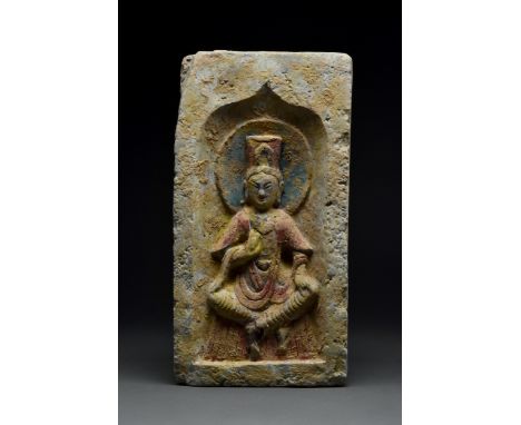 Northern Wei Dynasty, Ca. 386-534 ADA grey pottery brick portraying Buddha in a seated pose wearing a voluminous robe. His ri