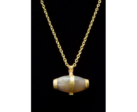 Ca. 100-300 ADAn elongated shape agate bead pendant banded with suspension setting and capped with gold fittings on both term