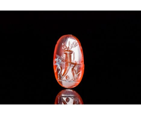 Ca. 100-200 ADAn oval-shaped carnelian intaglio, skilfully engraved with a cornucopia to the centre with a satyr to the left 