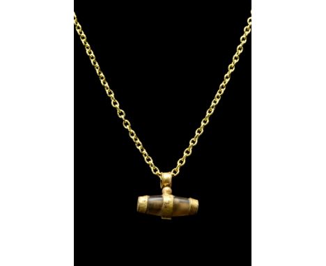 Ca. 100-300 ADAn elongated shape agate bead pendant banded with suspension setting and capped with gold fittings on both term
