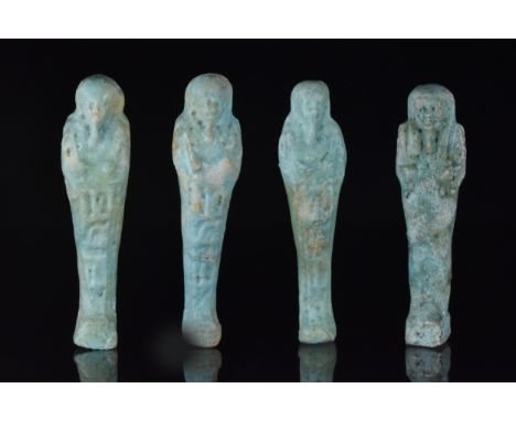 Late Period, 30th Dynasty, Ca. 332 BCA selection of four ushabtis, each in mummiform wearing a plain tripartite wig; the arms