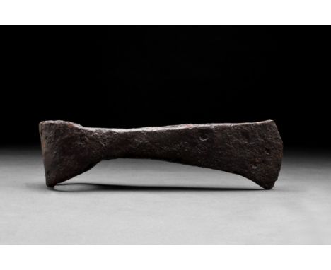 Ca. 900-1000 ADAn iron axe head comprising a short, curved blade, elongated cheek, lozenge-shaped poll and round socket. The 