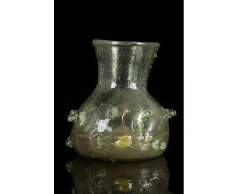 Ca. 300-400 ADA fantastic flask comprised of translucent glass with a funnel-shaped neck with folded rim and a squat lower bo