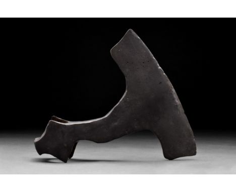 Ca. 900-1000 ADA hand-forged iron axe head with a substantial curved blade and elliptical shaft-hole. The profile is square a