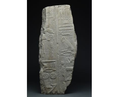 Ca. 2050-1786 BC A large limestone carved in raised relief with two columns of hieroglyphs containing titles of an official, 