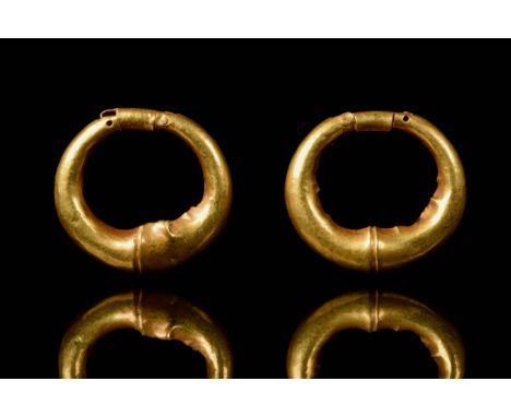 Ca. 800-400 BCA finely modelled Archaic Eastern Greek or Achaemenid Empire matching pair of gold pennanular earrings. Each ea