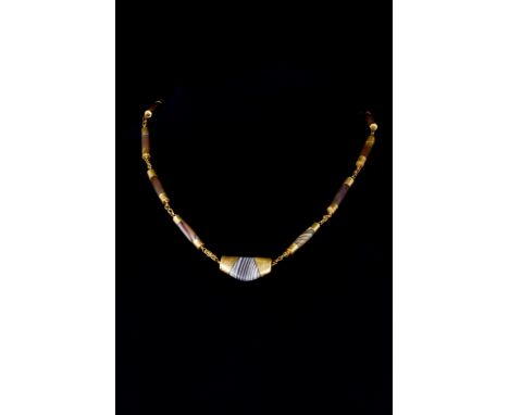 Ca. 100 BC - 100 ADAn Ancient necklace composed of tubular-shaped agate beads with applied gold fittings to each end and shor