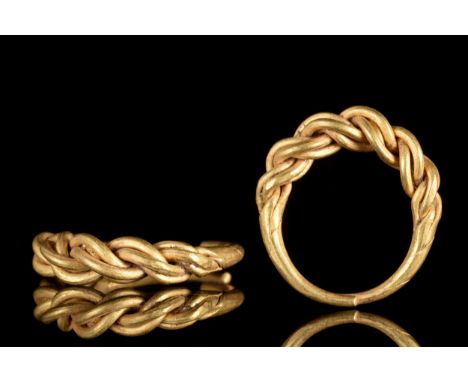 Ca. 900 ADAn amazing finger ring formed of rods of gold wire twisted into an expanding median section. The band tapers to the