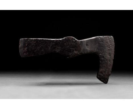 Ca. 900-1100 ADAn iron bearded axe head with a slender and long curved blade and a reinforced poll that may have been used as