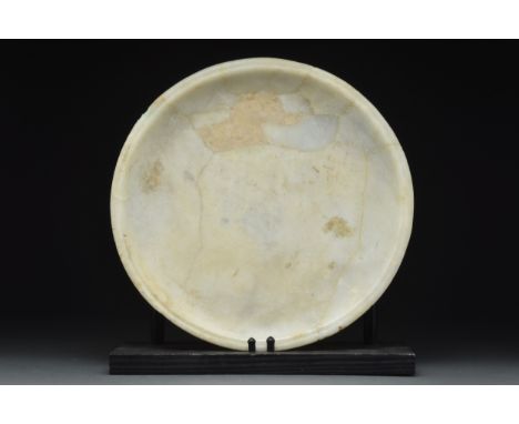 Late Period, Ca. 664-332 BCA large carved semi-translucent alabaster shallow dish, having low upturned edge, a flat rim, a gr