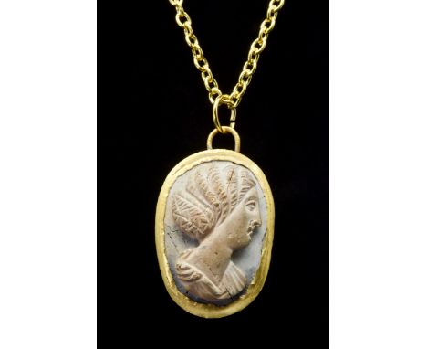 Ca. 200 ADA gold ovoid pendant setting with a suspension loop enclosing a cameo depicting a bust of Julia Domna, the Roman em