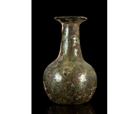 Ca. 1-100 ADA glass flask with a globular body with a concave base. The straight cylindrical neck ends with an outward-folded