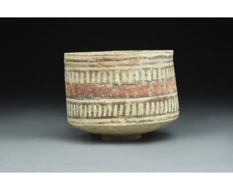 Ca. 2700-2000 BCA finely modelled pottery cup with a circular foot, a broad base, tall walls, and a slightly flared rim surro