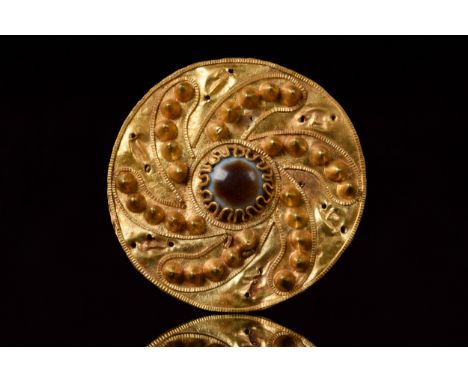 Ca. 300-100 BCHellenistic Period A finely rendered Greek Hellenistic gold disc-shaped brooch/pendant, hammered from thin gold