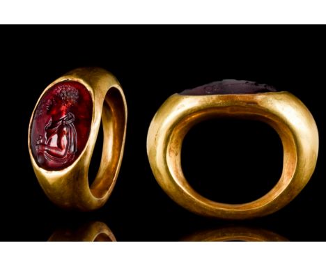 Ca. 100-200 ADA beautifully formed D-shaped, a hollow gold ring with garnet intaglio depicting a bust of God Mercury facing l