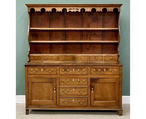 GOOD NORTH WALES OAK DRESSER circa 1840, having a decorative apron to the stepped cornice, shaped sided three shelf rack with