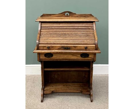 VINTAGE OAK ARTS &amp; CRAFTS-STYLE TAMBOUR FRONT WRITING DESK, having a pierced top rail with shutter fall and pigeon hole i