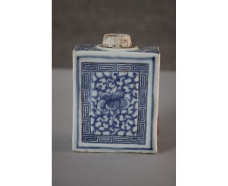 A 19th century Chinese blue and white porcelain rectangular tea caddy with hand painted floral design and swirling border. H.