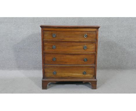 A 19th century mahogany Georgian style small chest of four drawers on shaped bracket feet. H.70 W.62 D.41 