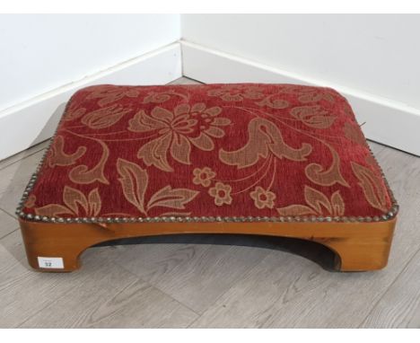 Vintage pine based low footstool with upholstered metal studded floral patterned cushion top, on wheels, very good condition 