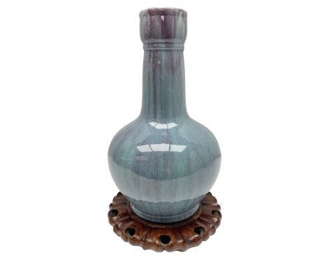 Blue glazed vase of squat baluster form with elongated neck, with merging streaked purple and light blue decoration, raised u