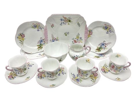 Shelley Wild Flowers pattern part tea service, comprising four cups and saucers, four dessert plates, cake plate, milk jug an