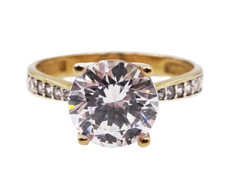 9ct gold cubic zirconia solitaire ring with stone set shoulders, hallmarked Condition Report:Approx 1.85 grams, size K-L