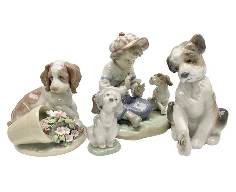 Lladro figures, comprising 'I Hope She Does', model no 5450, 'New Friend' model no 6211, 'It Wasn't Me' model no 7672 and 'A 
