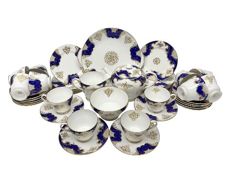 Shelley Empire pattern tea service for twelve, decorated with borders of electric blue and gilt foliate design on plain white