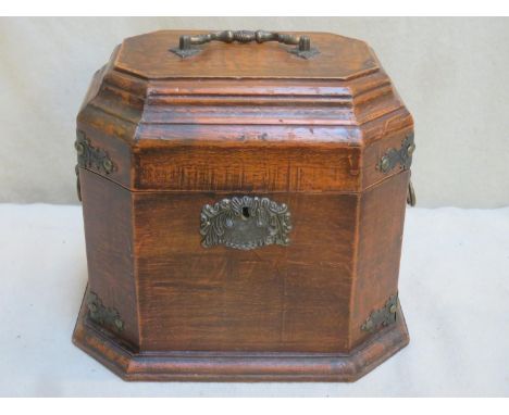 Brass bound mahogany octagonal decanter box, with hinged cover. Approx. 25cm H x 29.5cm W 