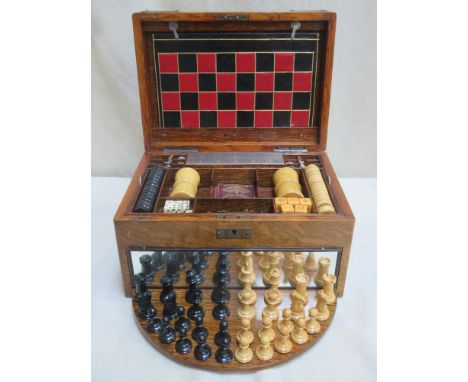 Victorian oak games compendium, possibly by Chad Valley, containing game pieces, Inc. leather playing board for chess, backga