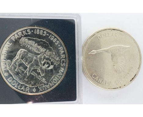 1985 silver proof commemorative round, National Parks, with a 1967 Canadian silver dollar (2). P&amp;P Group 0 (£5+VAT for th