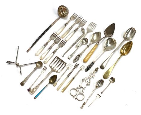 A mixed lot of silver flatware, to include a set of six mother of pearl handled hors d'oeuvre forks; a small toddy ladle with