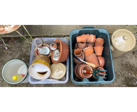 Two crates of various terracotta and other plant pots; together with several stoneware bread bins etc 