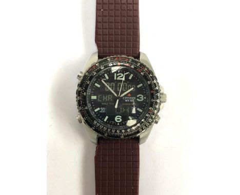 A Citizen Promaster WR 100 gents watch, with burgundy rubber strap 