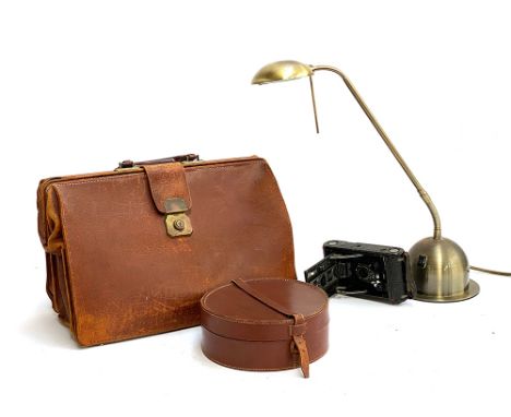 A leather gladstone style bag; collar box, Kodak Junior bellows camera and a modern brushed metal desk lamp 