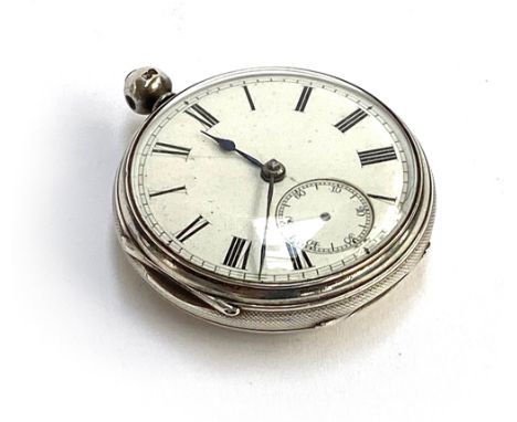 A Victorian engine turned silver open face pocket watch, key wind, London 1877, white enamel dial with Roman Numerals, 44mm d