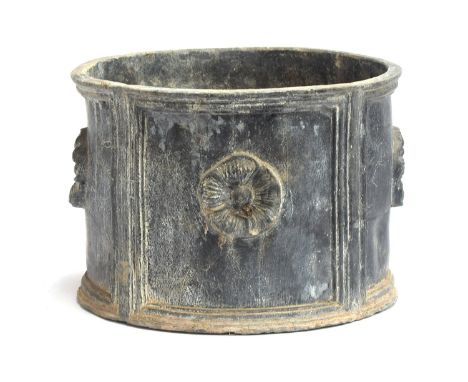A heavy circular lead planter with floral decoration, 30cm diameter, 21cm high 