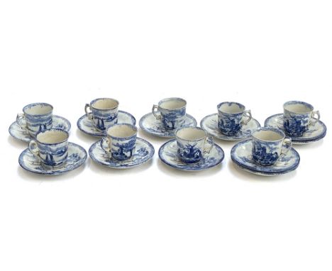 A set of nine 19th century Empire Works Stoke-on-Trent hand painted Delft style blue and white coffee cans (9) and saucers (1