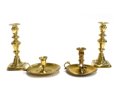 Two 19th century brass chamber candlestick holders; together with a pair of brass candlestick holders, 22cmH 