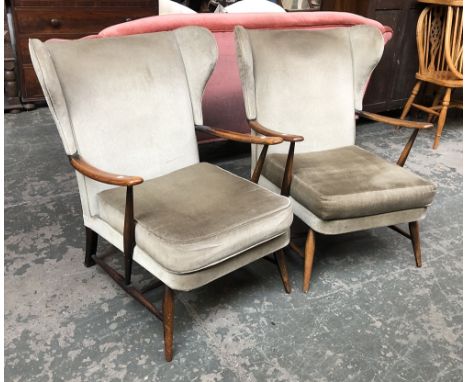 A pair of Ercol wingback armchairs 