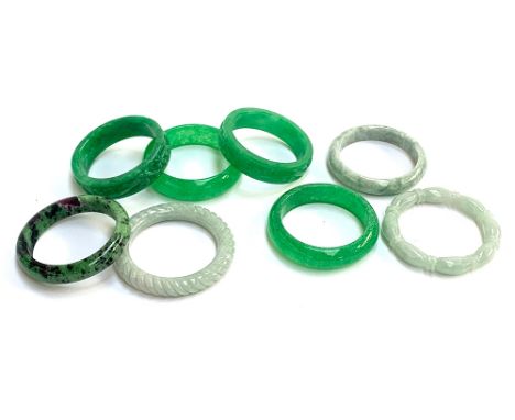 Six carved jade bangles; together with a ruby zoisite bangle 