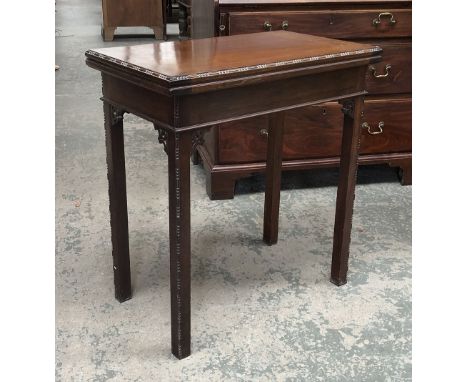 A mahogany card table in George III style, 69cmW; together with a nest of three tables with leather inset tops, the largest 5